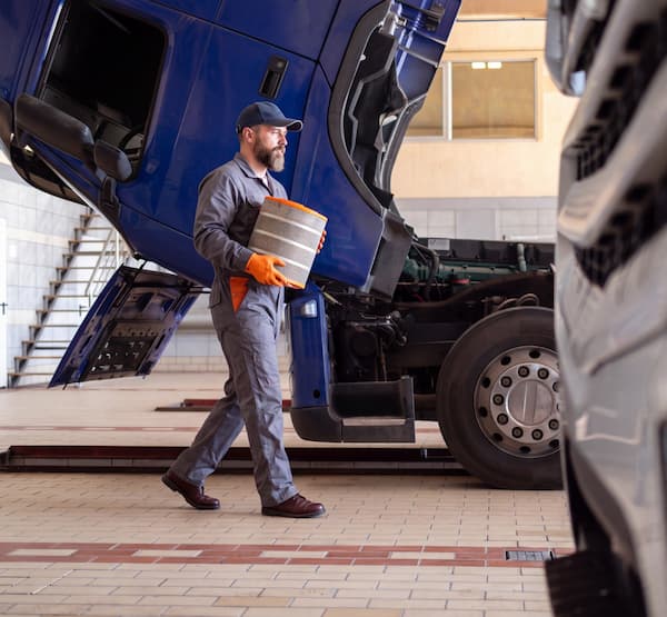 A truck maintenance person at work